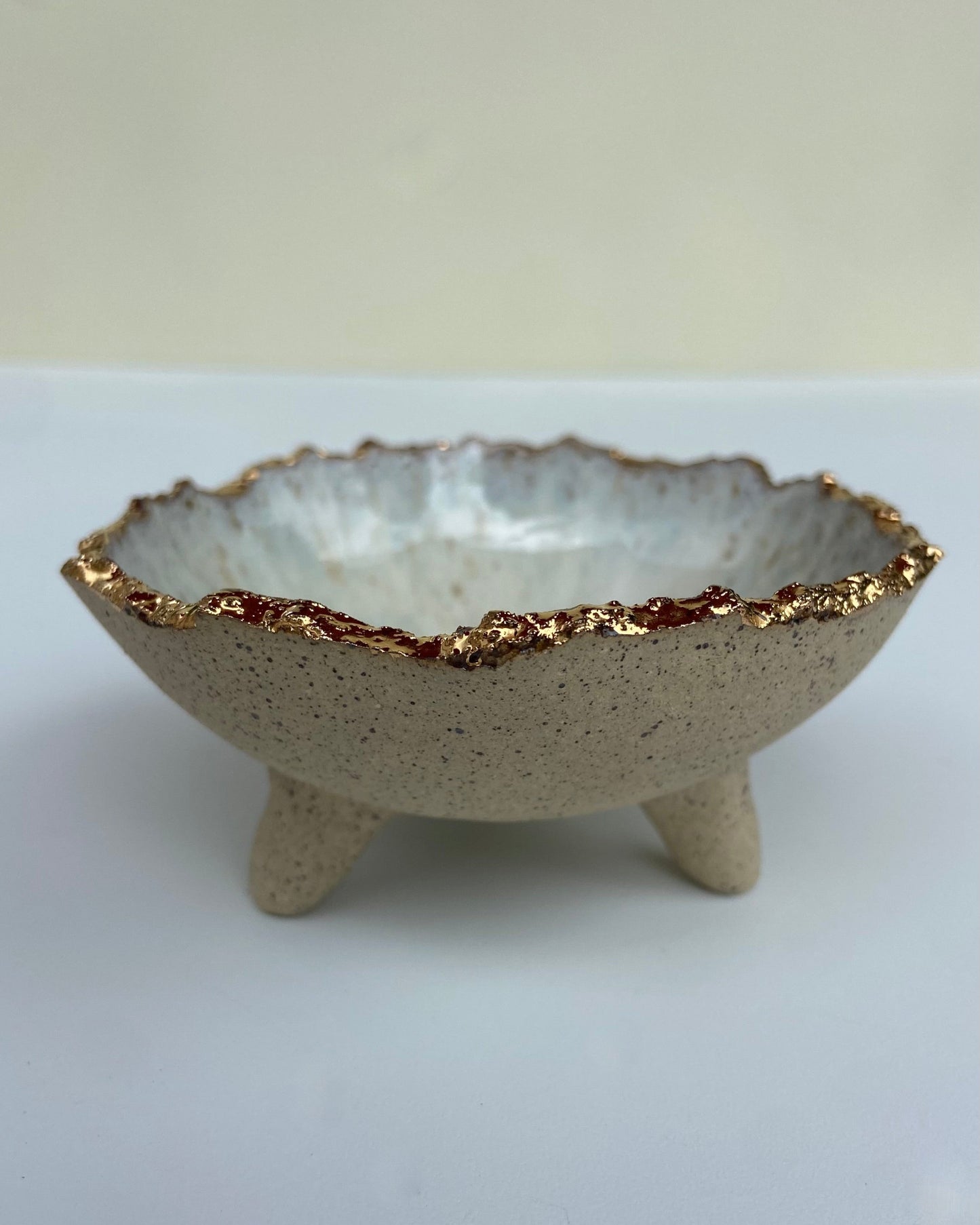 jewelry or trinket dish. Gold luster rim with glossy white glaze.