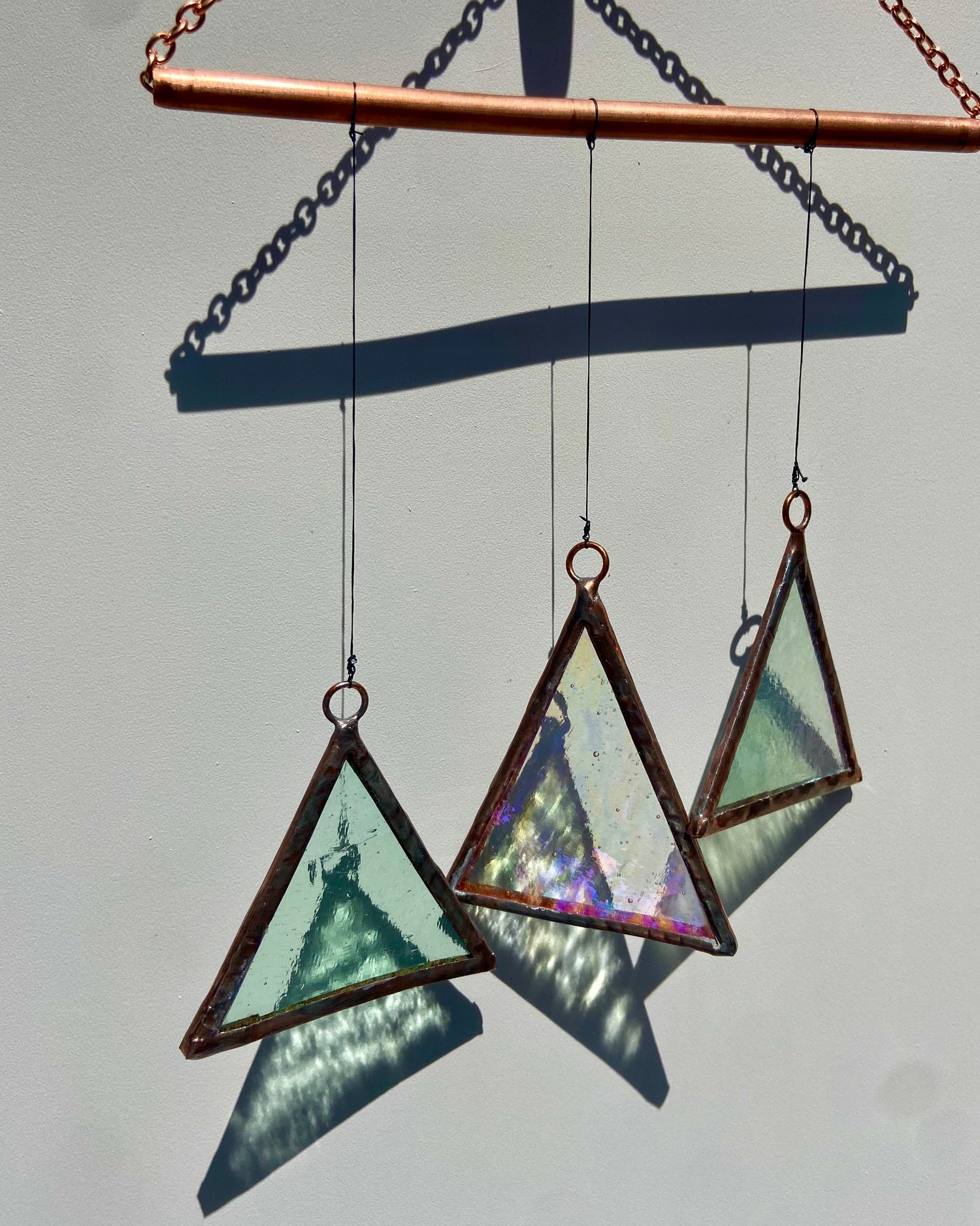 Stained glass suncatcher with triangles and copper details