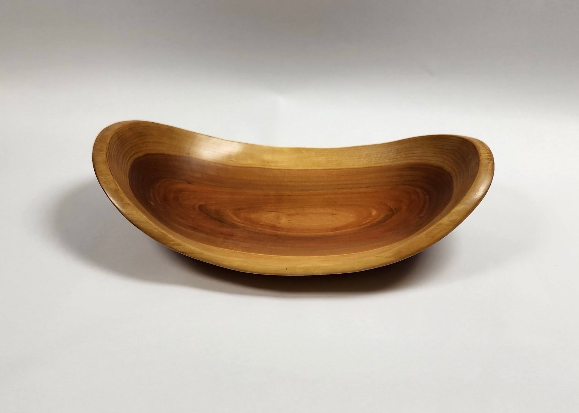 Black cherry wood bowl with natural edge. 