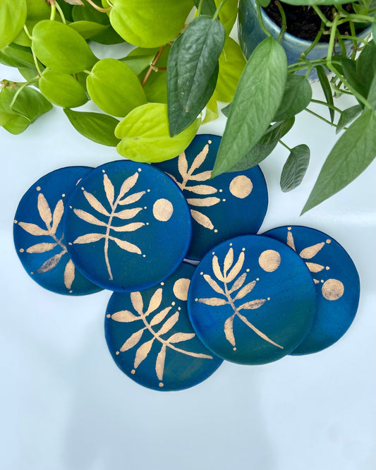 Blue painted ceramic dish with painted gold leaf and moon