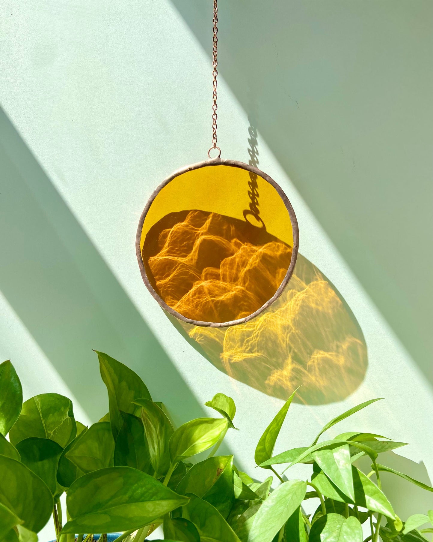 orange stained glass suncatcher, copper detail, circle glass