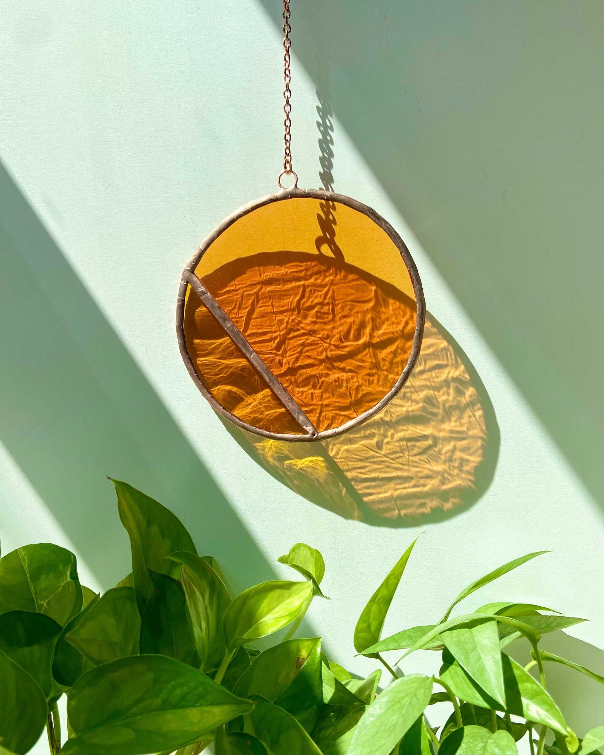 stained glass suncatcher, orange circle, copper details